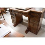 An attractive 19th century Gillows of Lancaster figured walnut break-front writing desk, the