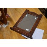 Local interest* Ernest John Oldcorn, an attractive Arts & Crafts oak wall mirror, of shaped