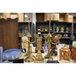 Two 20th-century brass candelabra-style table lamps; sold with a resin draping swag and ribbon-motif