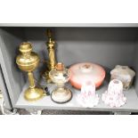 A selection of late 19th to early 20th-century lamp fittings, to include two oil lamps; a gilt-brass