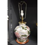 A late 20th-century floral ceramic lamp base, of baluster form, featuring a hand-painted peony-style