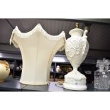 A large 20th-century Neoclassical-style white porcelain urn lamp base, featuring detailed high-