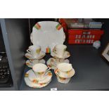 A 1930's Alfred Meakin Art Deco design part tea set, the conical cups with angular handles and