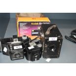 A Ensign 21/4B box camera, a bakelite Kodak Baby Brownie (as found), a Coronet Flashmaster and a