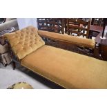 A Victorian chaise longue having mahogany frame and later ochre dralon upholstery, length approx.