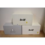 A trio of collectible teddy bears manufactured by Margarete Steiff GmbH. The collection includes