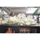 A fine early 20th-century Mintons floral tea set, to feature traditional floral sprays upon a mint