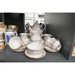 A 20th-century Paragon china 'First Choice' tea set, featuring delicate floral detailing with gilt