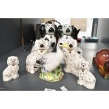 Four 20th-century Royal Doulton Wally dogs; sold with a larger pair of Staffordshire-style