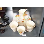A 1930's Alfred Meakin Art Deco design part tea set, the conical cups with angular handles and