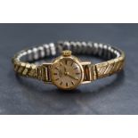 A 9ct gold cased Rotary wristwatch, the champagne dial having baton markers, marked 375, on a gold