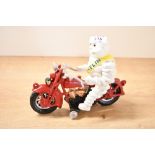 A boxed painted cast Michelin man on a Motorcycle model