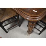 A Victorian mahogany wind out dining table , with leaf and winder