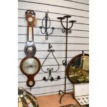 Two vintage wrought iron wall sconces, featuring minimalist arm detailing; sold with a tall
