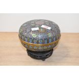 A 20th-century Chinese cloisonné lidded box, featuring intricate scrolled floral and foliate