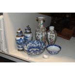 Two Chinese famille rose porcelain vases (both with damages and repairs) sold along with a pair of