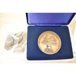 A bronze commemprative medallion celebrating 150 years of P&O Shipping sold along with 25 George V