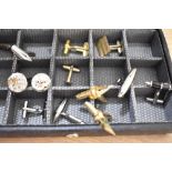 A faux leather jewellery box, containing an assortment of cufflinks, including novelty pen