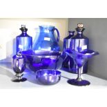 A collection of cobalt Bristol blue art glass items including a pair of mouth blown apothecary