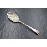 A George III silver berry spoon, having floral decoration to the bowl and terminal, with a vacant