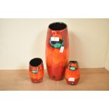Three late 20th-century Poole Pottery 'Volcano' vases, featuring a vibrant red and orange reactive
