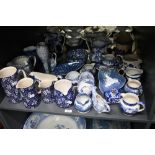 A quantity of late 19th to 20th-century blue and white transferware, to feature graduated ewers,