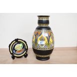 A vintage Dutch Rembrandt Pottery decorative vase, featuring colourful foliate detailing; sold