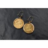A pair of 9ct gold half sovereign set drop earrings, comprising a 1900 and a 1914 half sovereign
