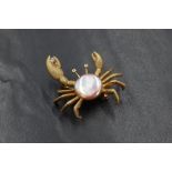 A 14ct diamond and pearl set crab brooch/pendant, the crab having a pink pearl set to the body