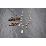 A 9ct gold moonstone set fringe necklace, the broken fine figaro link chain having thirteen
