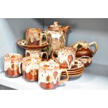 A vintage Fosters Studio Pottery coffee set, featuring a 'honeycomb' brown drip glaze, to include
