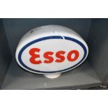 A large mid 20th-century ESSO glass petrol pump globe, featuring the iconic red and blue script logo