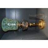 A fine and unusual Victorian brass oil lamp, having a moulded uranium glass shade with thistle