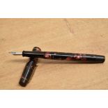 A De La Rue Onoto the pen button fill fountain pen in Rose and Black marble with single cap band