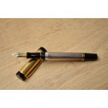 A boxed Parker Duofold International with silver reeded barrel and gold cap. (possible marriage)