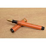 A Coral King outsized lever fill fountain pen
