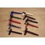 A group of ten lever fill fountain pens including Osmiroid and Waltham