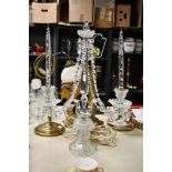 A contemporary Georgian-style crystal cut glass two-light table candelabra, featuring a central