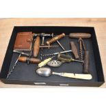 A selection of 19th to early 20th-century corkscrews and multitools, to feature an EPNS and bone-