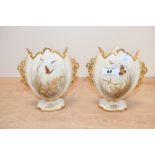 Two late 19th to early 20th-century Royal China Works Worcester blush ivory decorative vases,