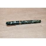 A Mabie Todd & Co Swan lever fill fountain pen in Green marble with single broad cap band having