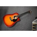 An Encore acoustic guitar, model ECN165 EAR (Cutaway)