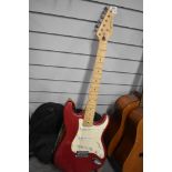A Raypierre Protone 3000 Stratocaster style electric guitar , sold with stand and small selection of