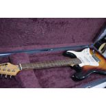 A Starsound 'stratocaster' type electric guitar in hard lined case