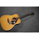 A Yamaha FG-180 acoustic guitar, having the desireable 'Red Label' , sold with hard fitted case