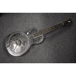 A traditional resonator steel guitar, possibly by Johnson, serial number stamped to top of headstock