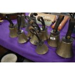 A set of 10 brass hand bells, the majority being stamped Mears (which became part of the Whitechapel