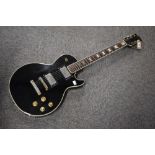 A Jedson lawsuit style (copy of Gibson Les Paul) electric guitar, with vinyl carry bag