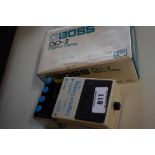 A Boss Digital Delay pedal, with original box