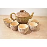 A modern Chinese Yixing style teaset, comprising a teapot formed as a woven basket of grain with